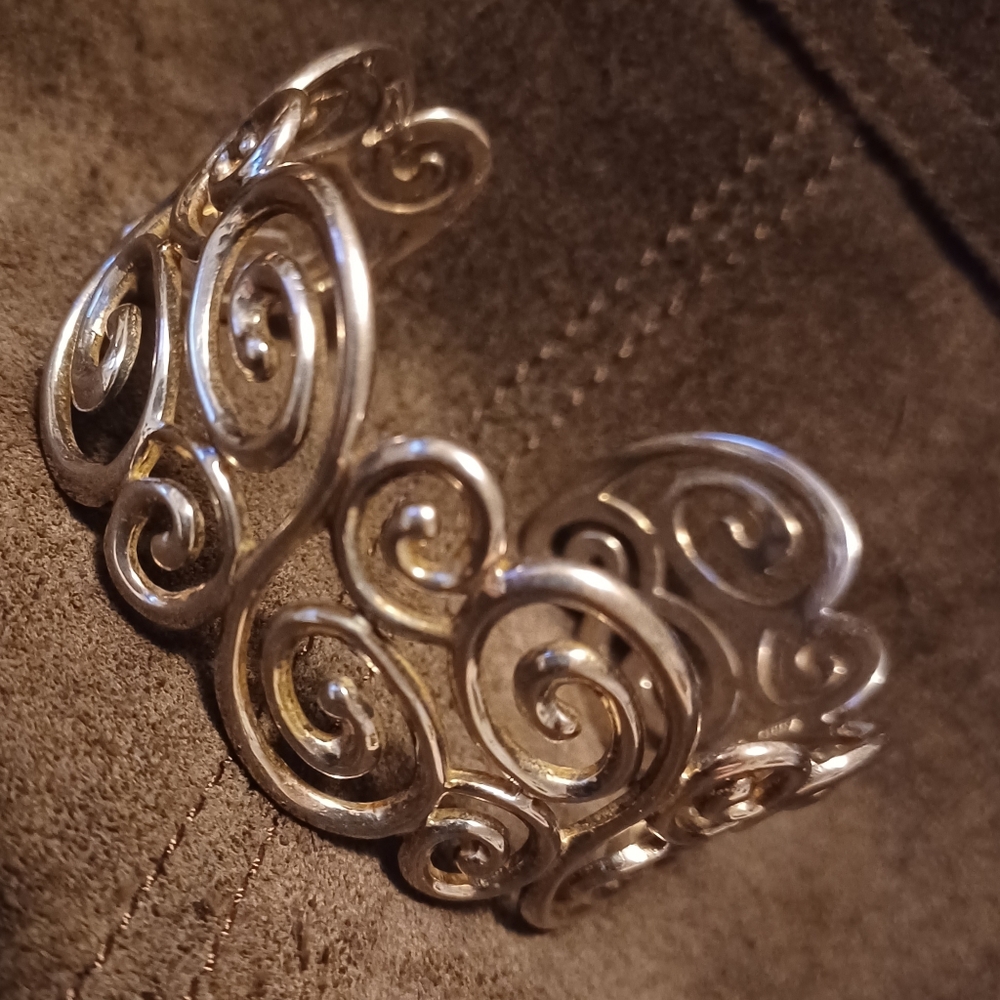 Silver swirls cuff.